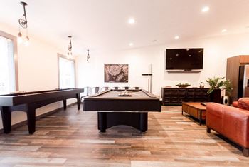 a game room with a pool table and a television at Notch 8, Tacoma, WA, 98444